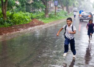 Jahangirnagar-Bangladesh-School-Boy-Running-Rain.jpg